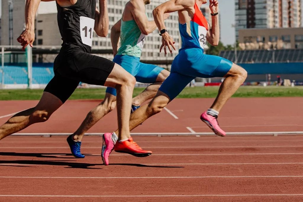 Sprinters running a competitive race on a track