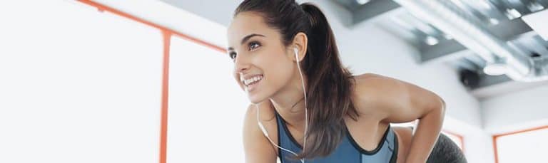 woman working out with headphones in