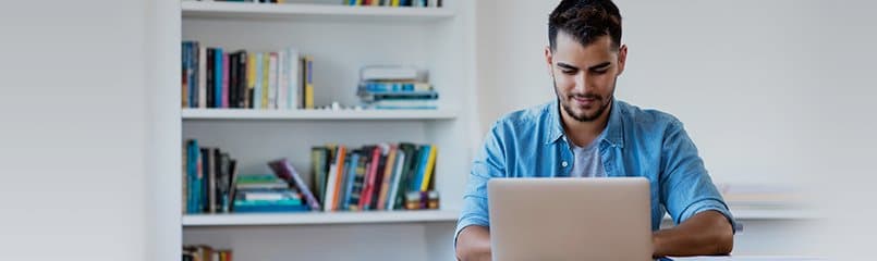 man working at a computer in an office