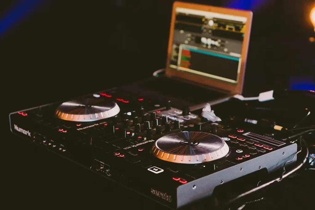 Close-up image of a DJ turntable in a dark room.