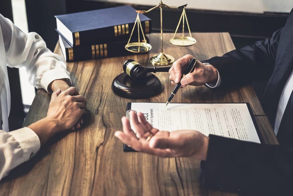 A Lawyer consults a client about legal responsibility