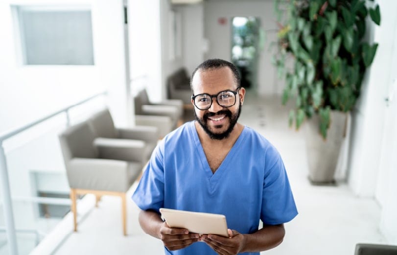 nurse at hospital holding an ipad