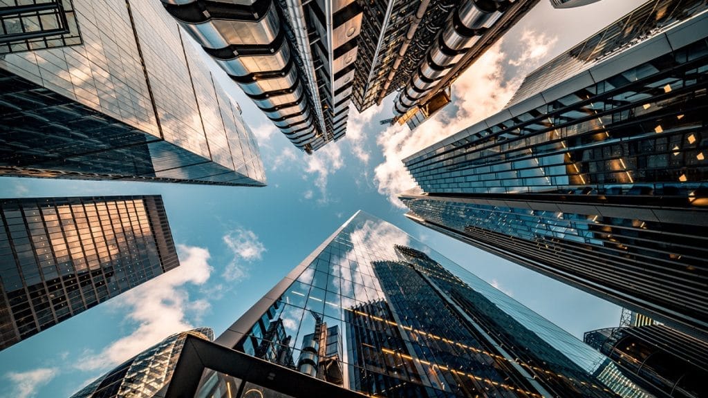 skyscrapers reaching up into the sky from below.