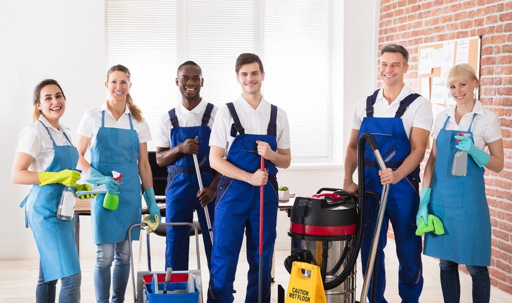 cleaning crew posing for picture