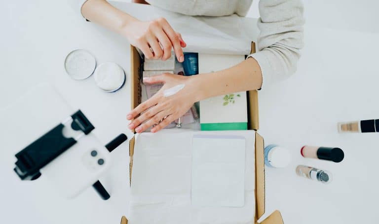 A woman tests out new beauty products to be sure they are safe, and she insures them with product liability insurance.