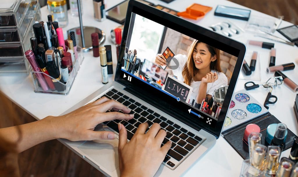 A women sets up her Facebook profile for her new business and gets ready to do a live product demonstration.