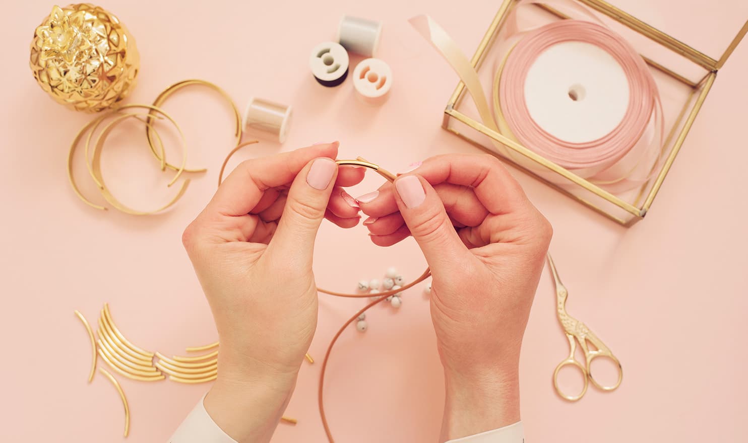 woman making jewelry