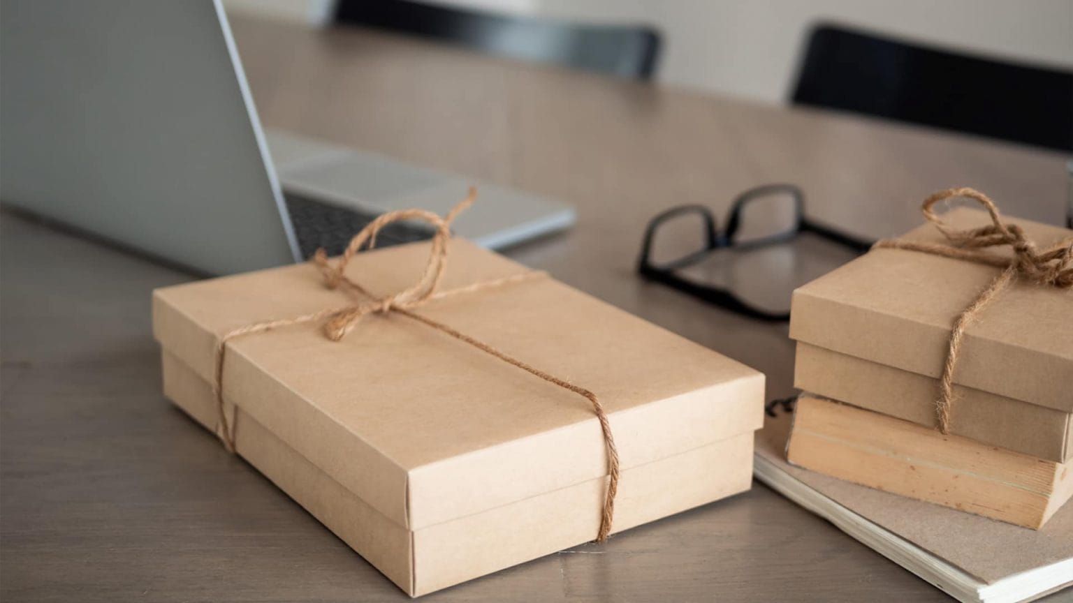 products packaged next to a laptop