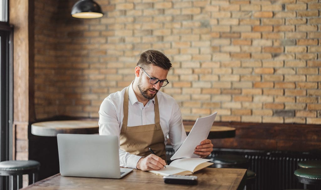 A young man is review a contract for a new business partnership before he buys the product liability insurance he is being required to carry for this partnership.