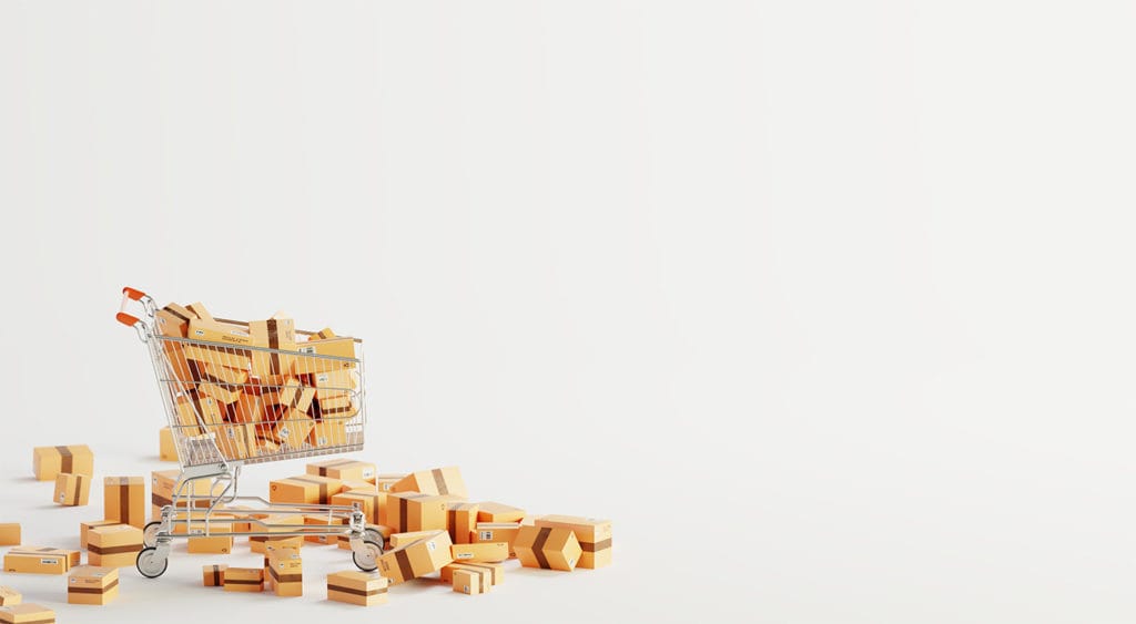A shopping cart full of cardboard boxes.