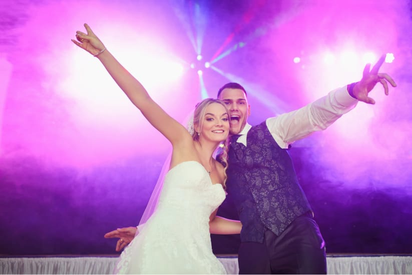 Image of Bride and Groom celebrating at party