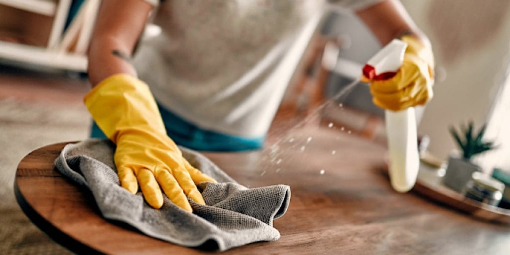 close up of someone cleaning a table