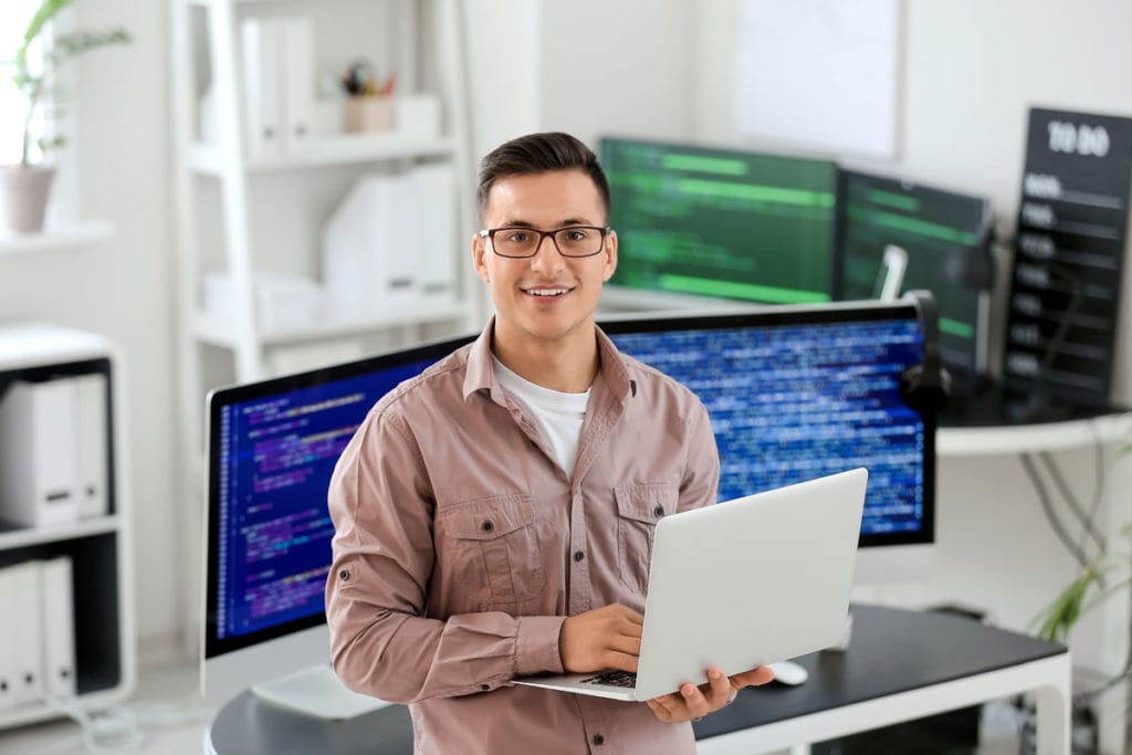 IT consultant holding laptop