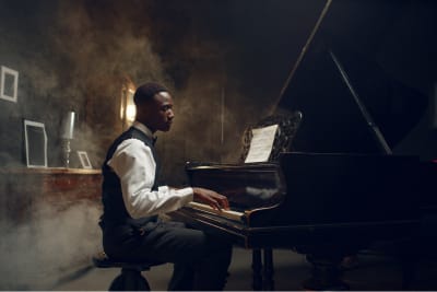 professional piano player at the piano surrounded by fog