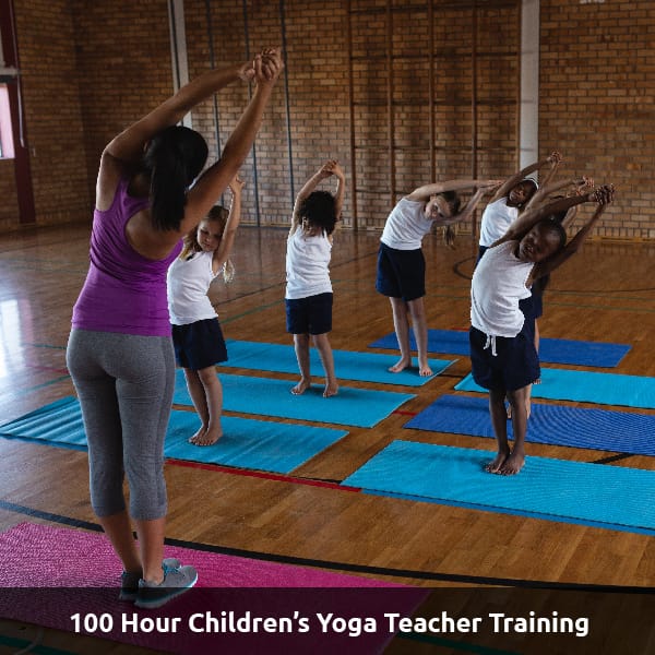 A yoga instructor reaches out, teaching children to do simple yoga stretches. Text Reads: 100 Hour Childrens Yoga Teacher Training.