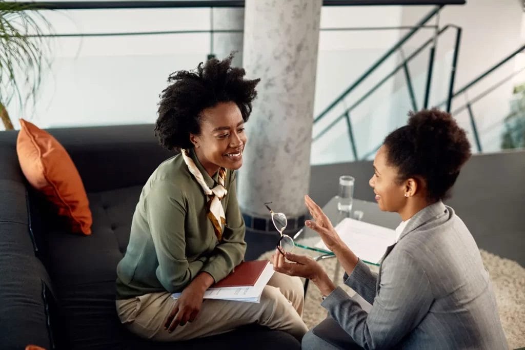 A career coach with her mentee at a meeting