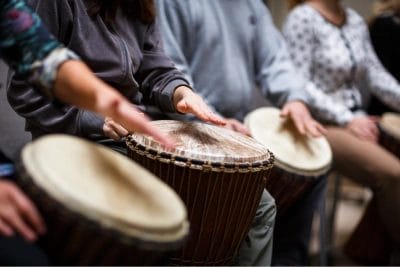 close up of hands on drums