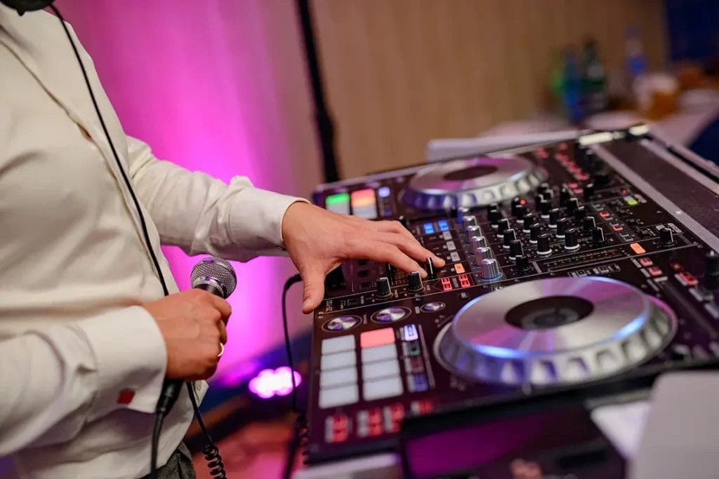 A DJ mixing jams at a wedding