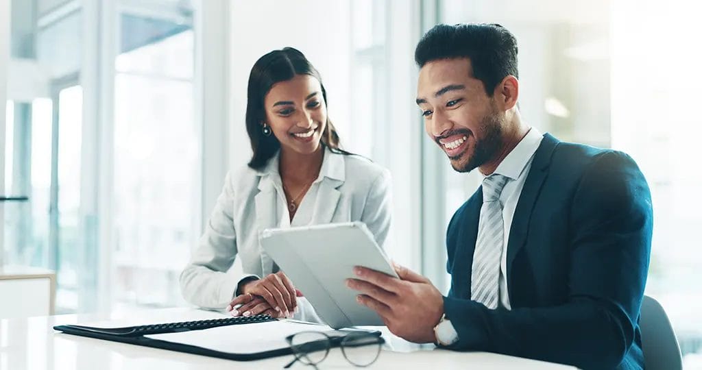 Image of two people in a business meeting