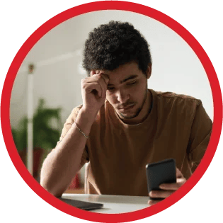 A tutor looking stressed while looking at smartphone.