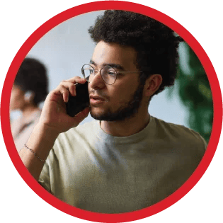 A tutor on the phone looking concerned.