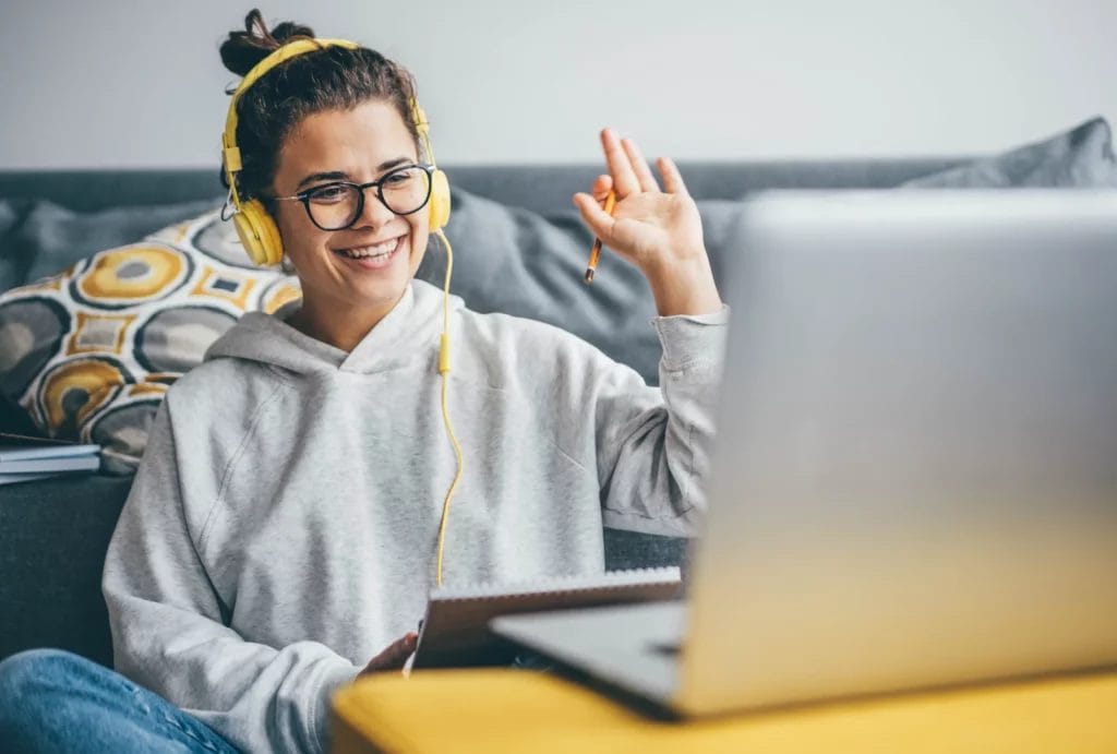 Tutor discusses homework with a student in a library