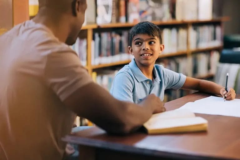 Private tutor with school aged child in a lesson