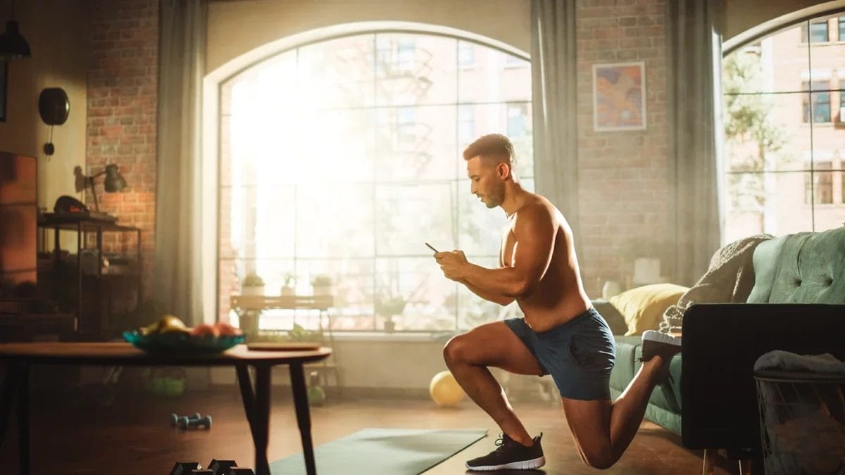 A personal trainer buys insurance online from home.