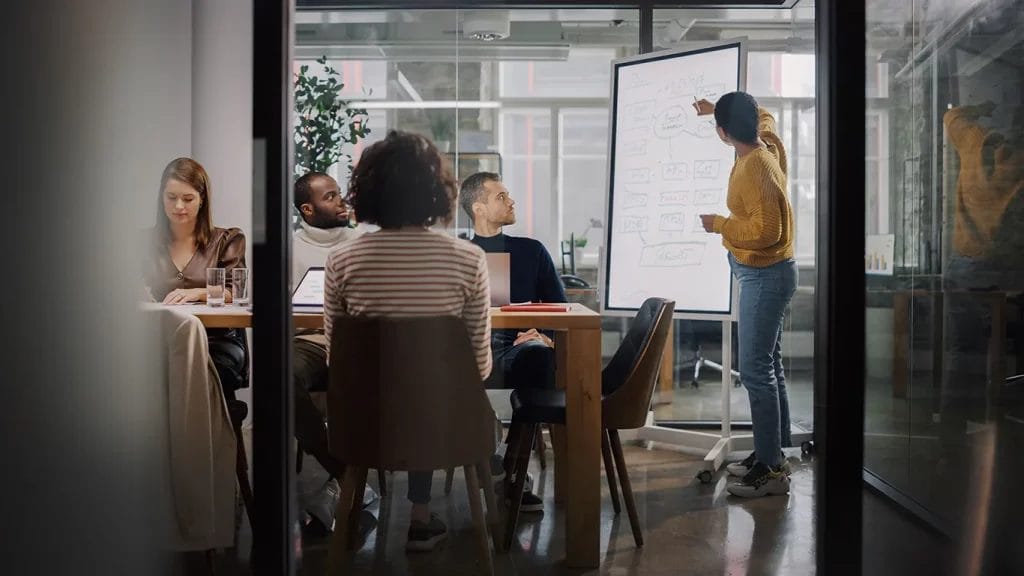 Marketing strategist presenting in front of stakeholders