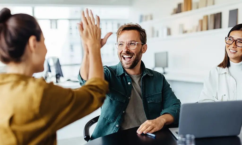 Two people giving a high five