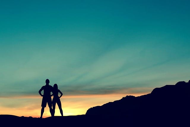 accomplished people atop a mountain