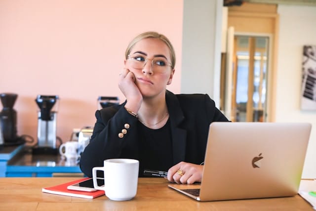 woman thinking at a desk