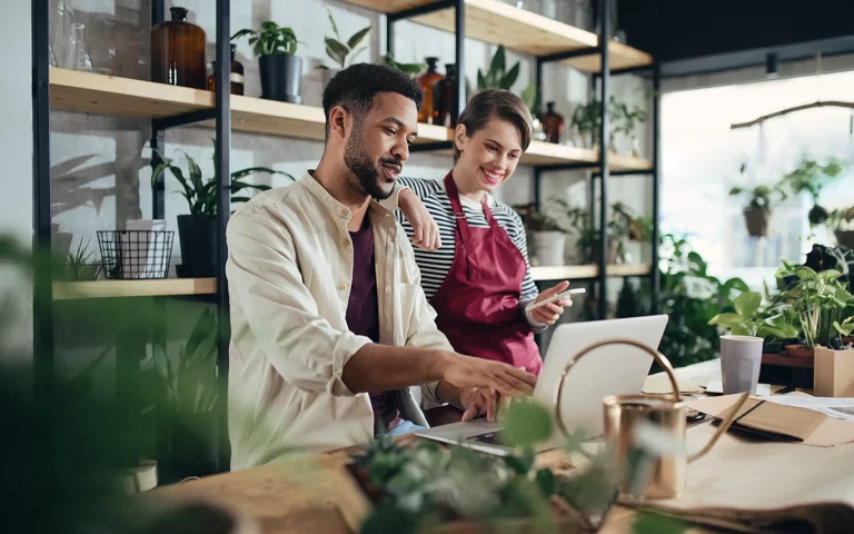 Small business owners looking at a laptop.