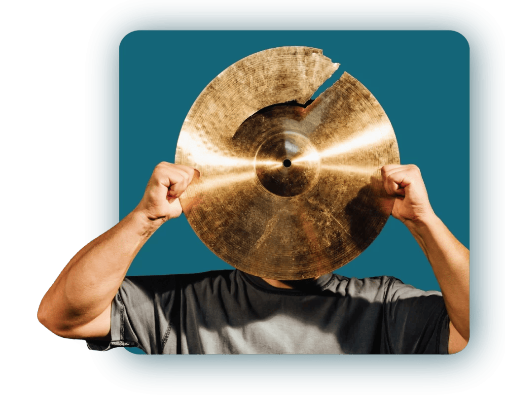 Person holding broken cymbal