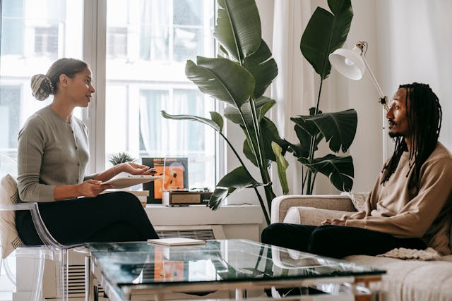 a female consultant talks to a male client