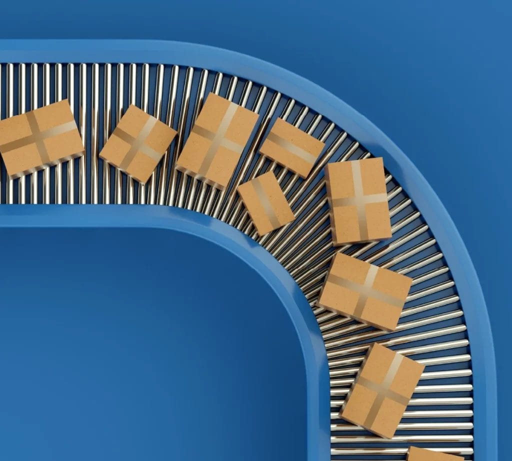 Packages being transported on a conveyor belt in a logistics or shipping facility.