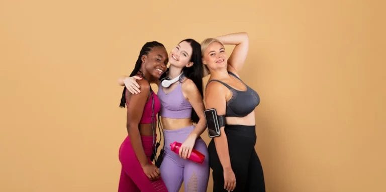 A group of clients pose together in exercise gear.