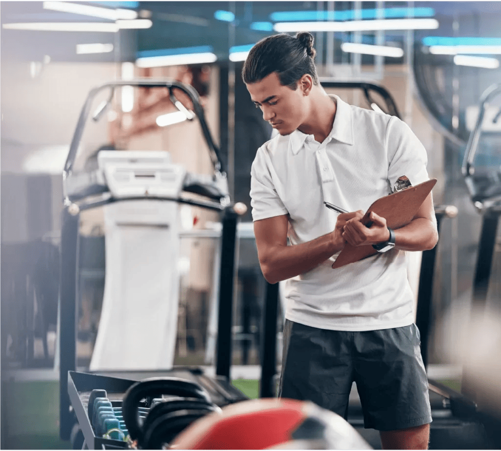 A man doing a check on gym equipment
