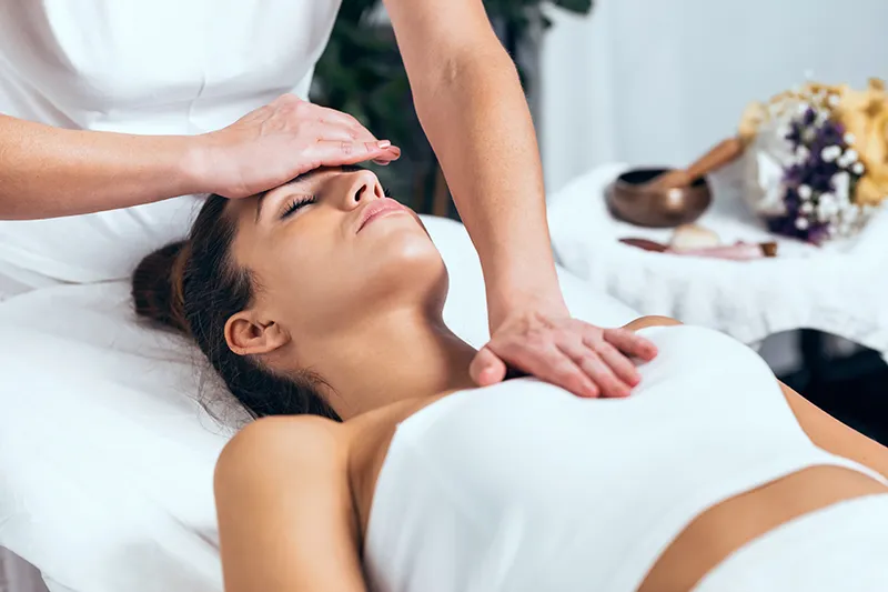 An image of a woman getting energy healing