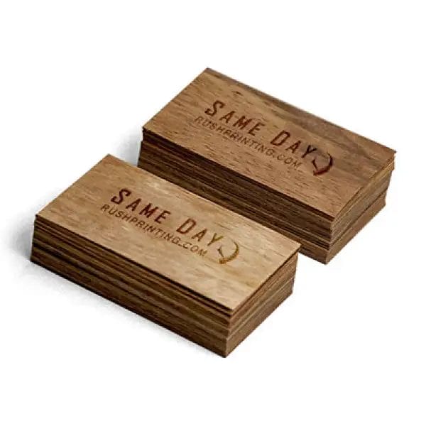 A stack of wooden business cards