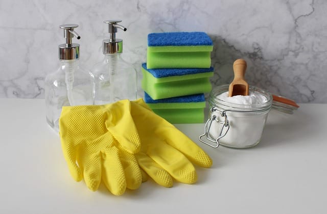 cleaning supplies on a marble countertop