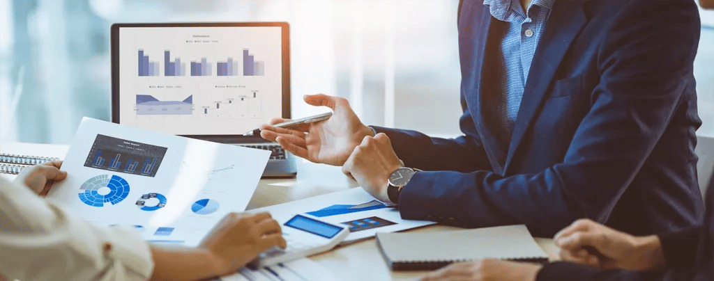image of a business team on a table with data.