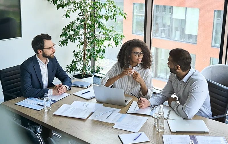 Image of people talking on a table