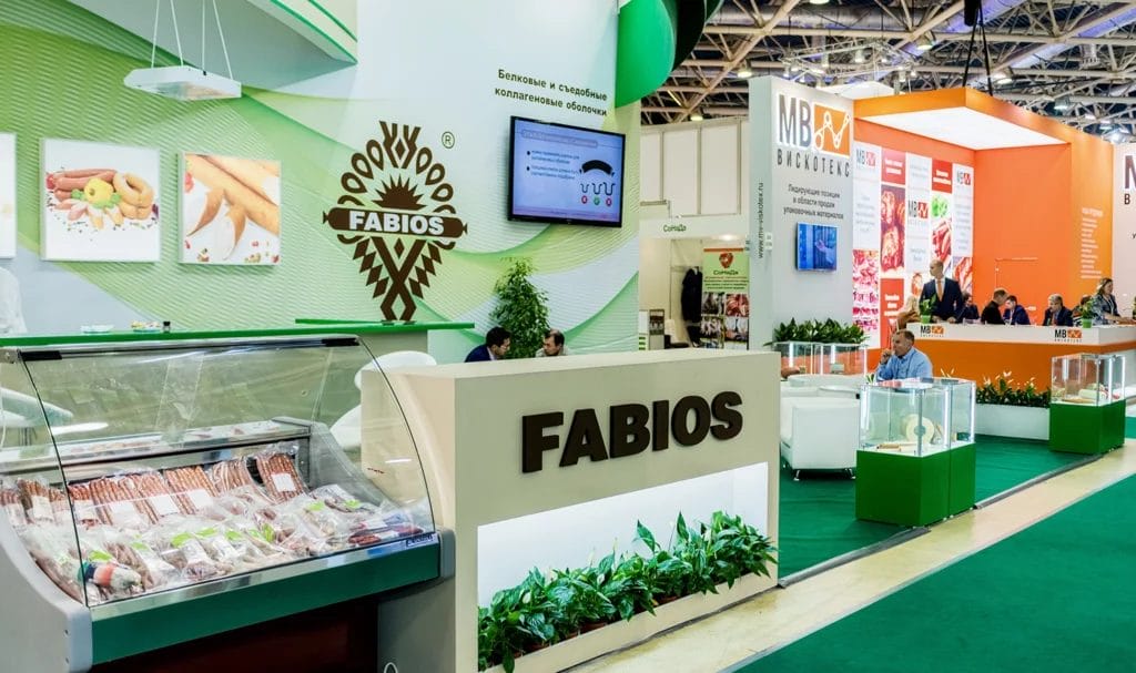A look at the Fabios booth at the International Exhibition for Equipment, Technologies, Raw Materials where they use a meat case and grocery store style set up to show their use of natural ingredients.