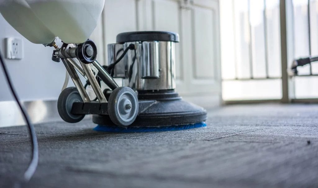 Carpet cleaning machine deep cleaning a commercial space.