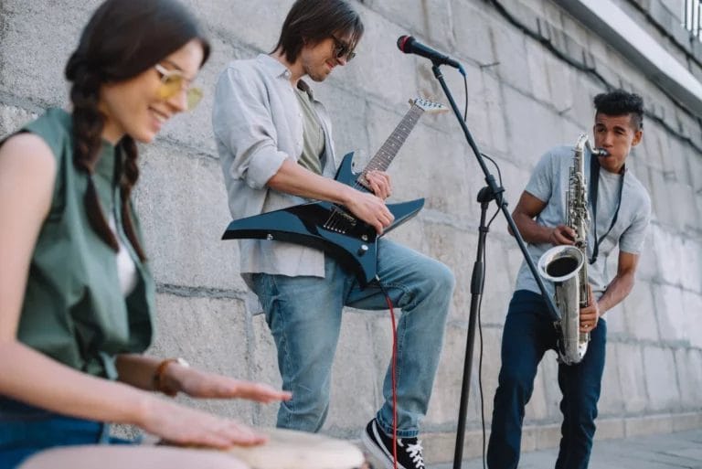 A band busking near a building.