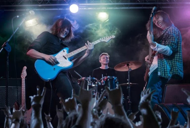 A band playing a live gig on stage.