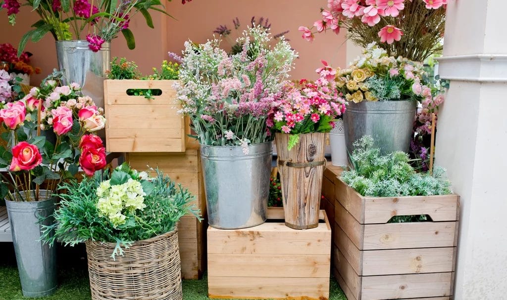 A close-up look at a flower vendor's display and inventory.