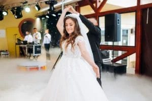 Newlyweds dancing to a live wedding band.