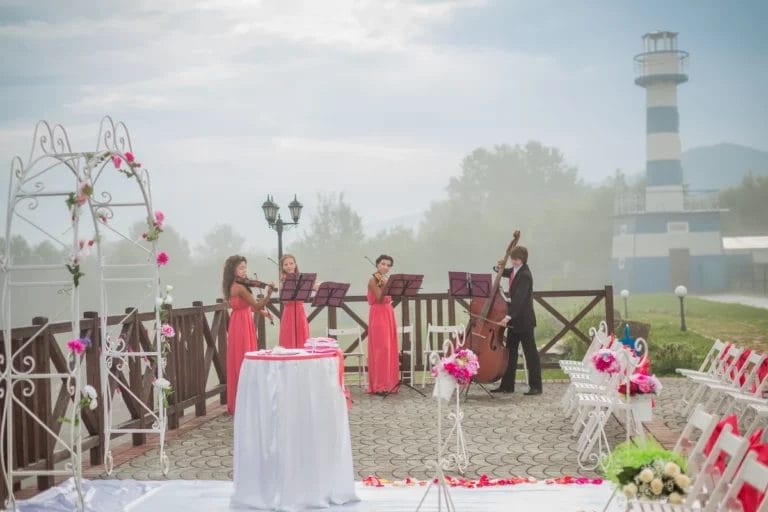 A string wedding band playing at an outdoor venue.